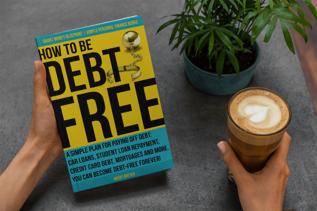 Picture of a person holding the book, How to Be Debt Free, by Avery Breyer. They are also holding a latte next to a houseplant.